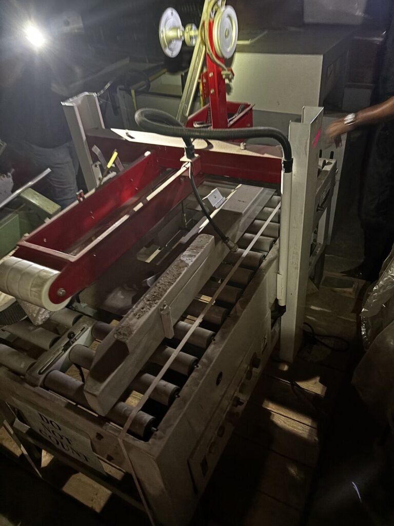 Palletized Conveyor Assembly — Powered Roller Bed with Belt Drive and Chute Section
