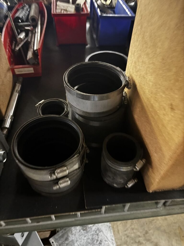 Lot of Flexible No-Hub Pipe Couplings with Stainless Band Clamps — Assorted Sizes